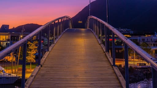 Sunset view over a wooden bridge leading to marina in Picton, New Zealand