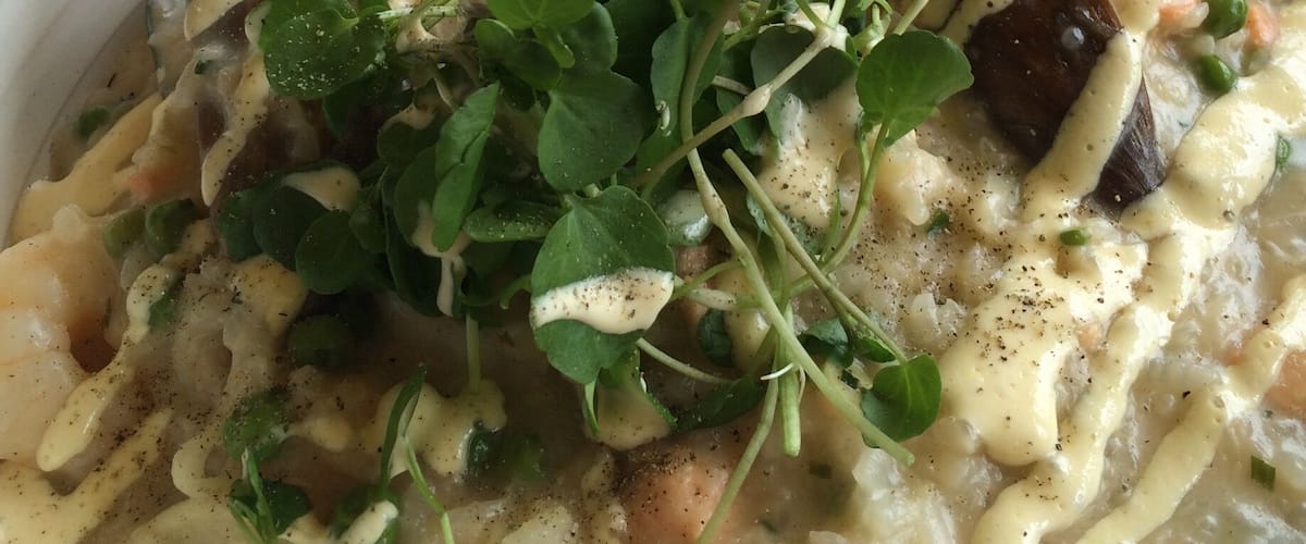 A vineyard with great food, tasty wine, beautiful views and outdoor beanbags. You can get bread and dips for $12, the seafood risotto was beautiful and with $27.