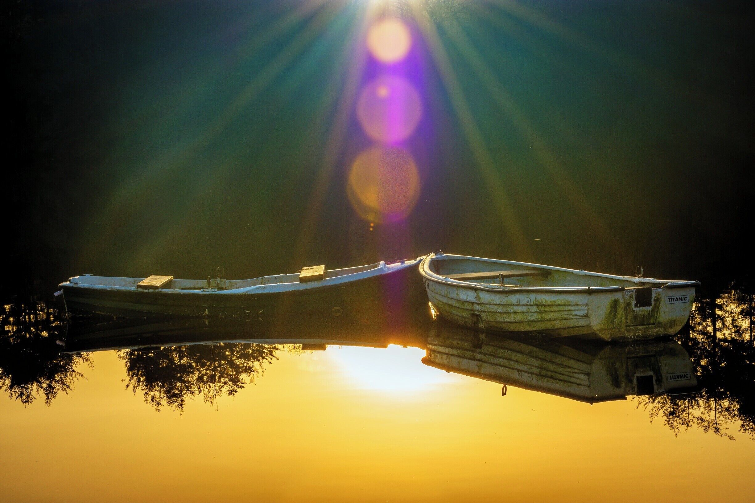 This photo was taken during sunset at the third reservoir in the aptly named Swiss Valley. Calm water at sunset with the gentle breeze slowly rocking the boats creates an absorbing scene. 