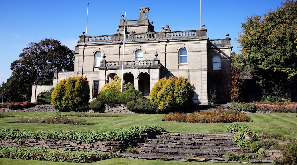 A historic building with a symmetrical facade, arched windows, and a central tower.