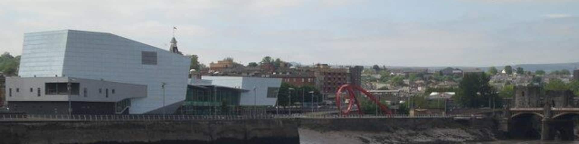 Riverfront Theatre and the west bank of the Usk Also showing the Steel Wave, Newport Bridge and a lot of Usk mud, this picture was taken from the east side of the footbridge