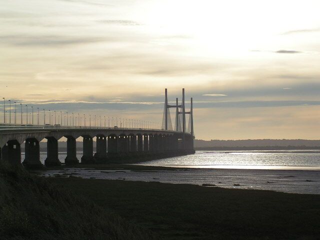 A bridge with multiple arches over a body of water.