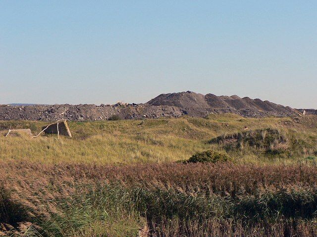 Tip and reed bed at Margam steelworks The steelworks borders Margam Burrows and a reed bed at this point. It is here that spoil from the works processes are dumped.