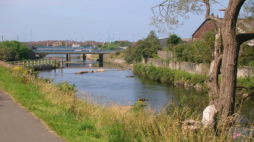 Normal tidal limit, Afon Afan, Port Talbot. Looking west, downstream, from Cramic Way. The sluice on the left hand side marks the normal tidal limit. National Cycle Network Route 4 follows the bank of the river here.