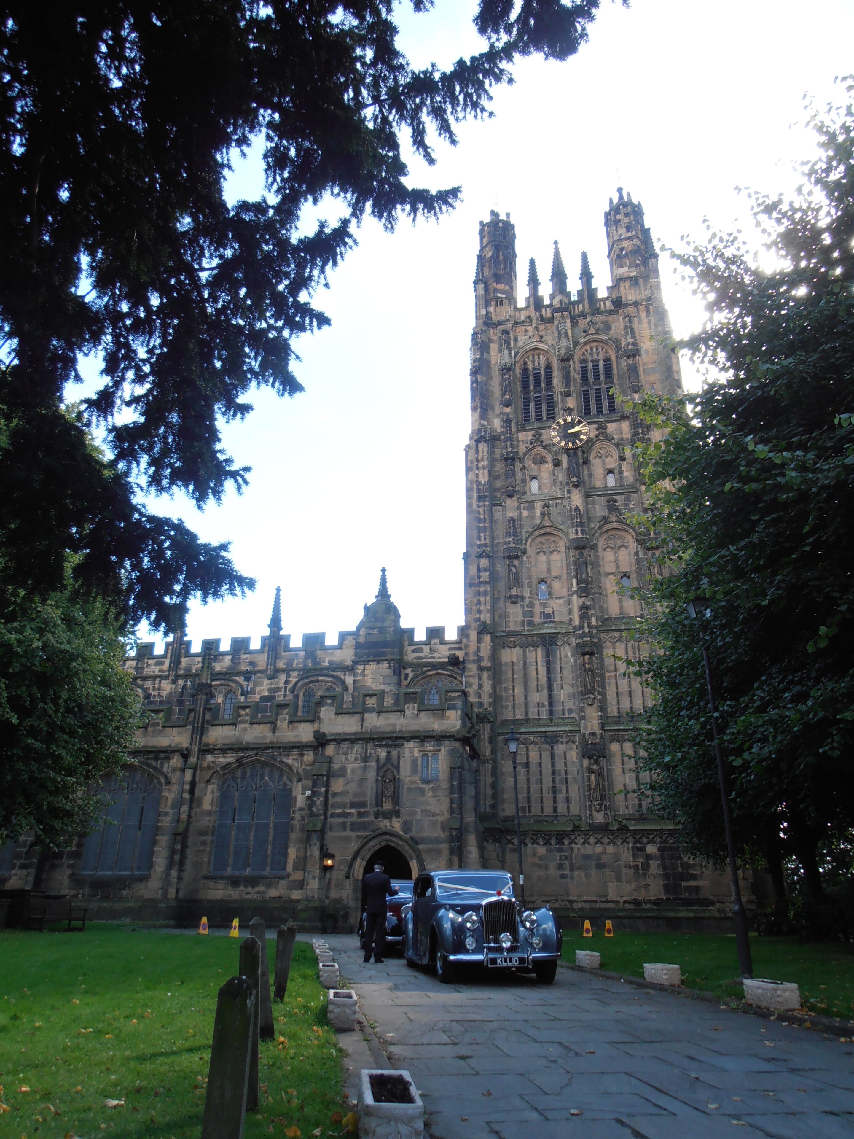 A historic building with a tall tower and arched windows.