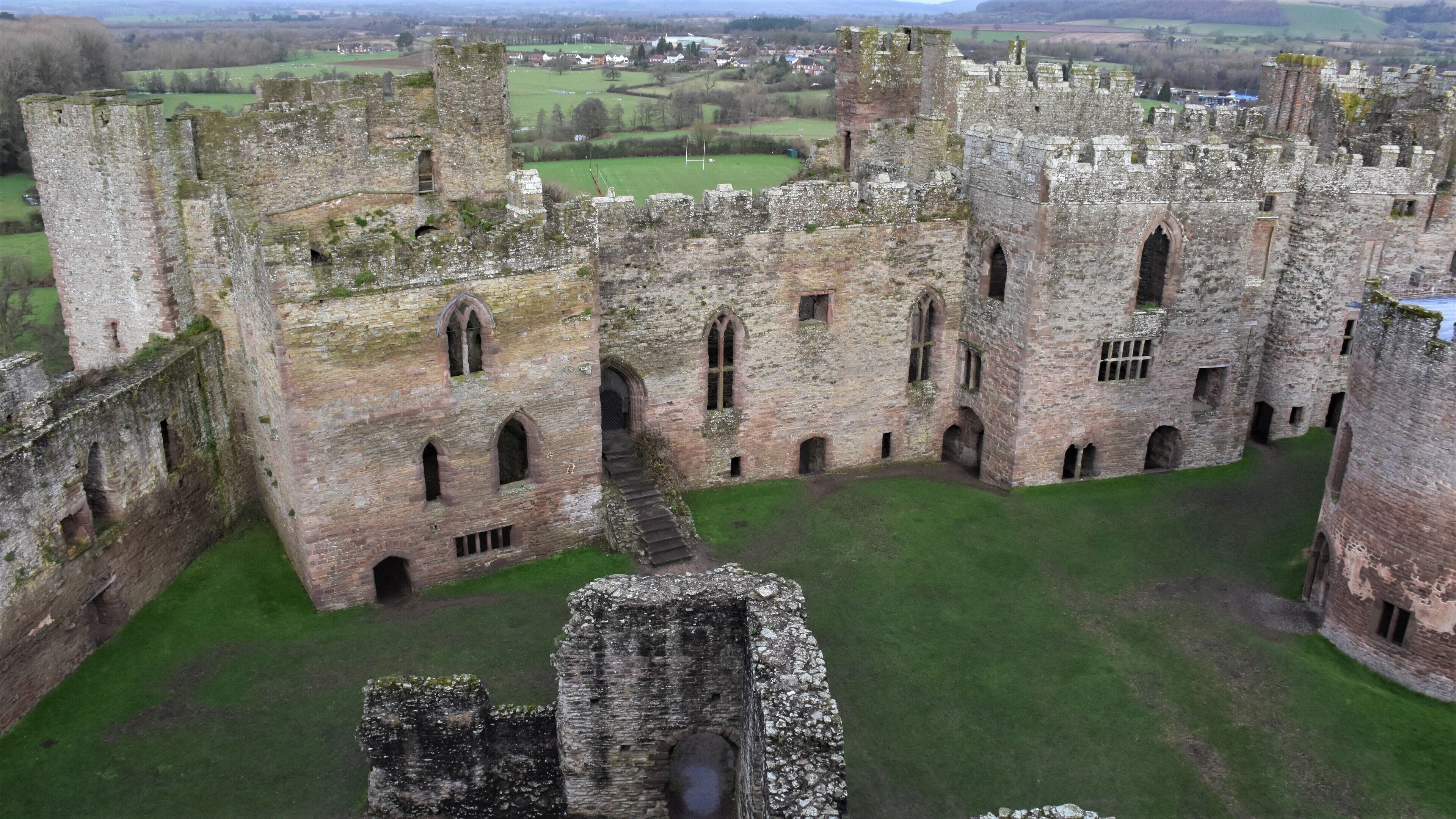 #lksawaydays 5a/2020 #lksawaydays After enjoying the previous weeks step back in time we decided for today's part 1 to continue on the theme of castles. With our destination programmed into the satnav we headed off to Shropshire to visit the medieval castle at Ludlow. Just before 10am after a pleasant 3 hour car journey #lksawaydays arrived in the Salop town of Ludlow, perfect timing as the site was just opening. At that time of the morning there was plenty of space for street parking, which are controlled by parking meters. After a short 2 minute walk we were greeted by a very jolly lady in the ticket office & shop who gave us our tickets and some information about the site. After paying the £7 per adult we left the shop and forged ahead to explore the 12th century fortification. Ludlow Castle sits alongside the River Teme and is one of the first stone castles to be built in England. The castle believed to be founded by Walter de Lacy in 1075 was empty, not a soul and we soon realised we were the only 2 people walking around the mossy defunct ruins, I did try my hardest to get Mrs LK to play hide and seek but after a long thoughtful pause she just shook her head at me! Ludlow castle has plenty of nooks and crannies to explore as well as a great view across Shropshire once you reach the top. A pleasant morning exploring a castle that has a rich history behind it came to a close. #lksawaydays give Ludlow Castle a 👍#uk #castle #outandabout #history #ludlow #travel