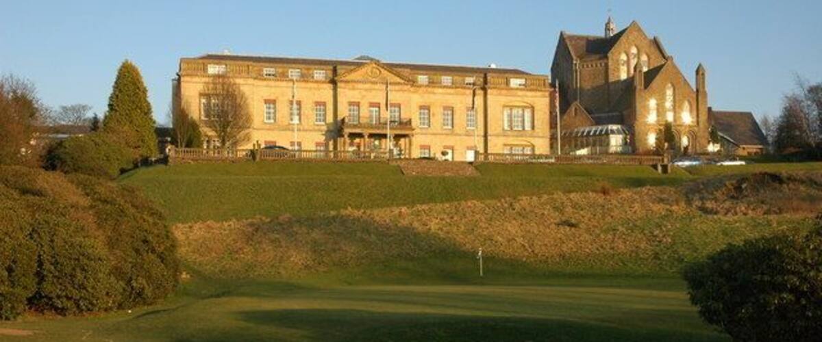 Shrigley Hall Hotel Shrigley Hall Hotel is a former country house which is now owned by the Spanish hotel chain Barcelo, the former church, seen on the right, is now a swimming pool and part of the leisure complex. The hotel grounds amount to a 262 acres golf course. This building has been a hotel since 1989, my old OS map from the 1970s indicates that this building used to be a college.