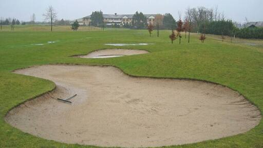 Five Lakes Resort A view of the hotel and country club complex of Five Lakes, seen across a very soggy golf course.