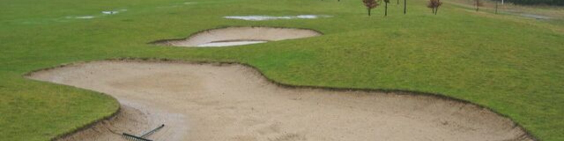 Five Lakes Resort A view of the hotel and country club complex of Five Lakes, seen across a very soggy golf course.