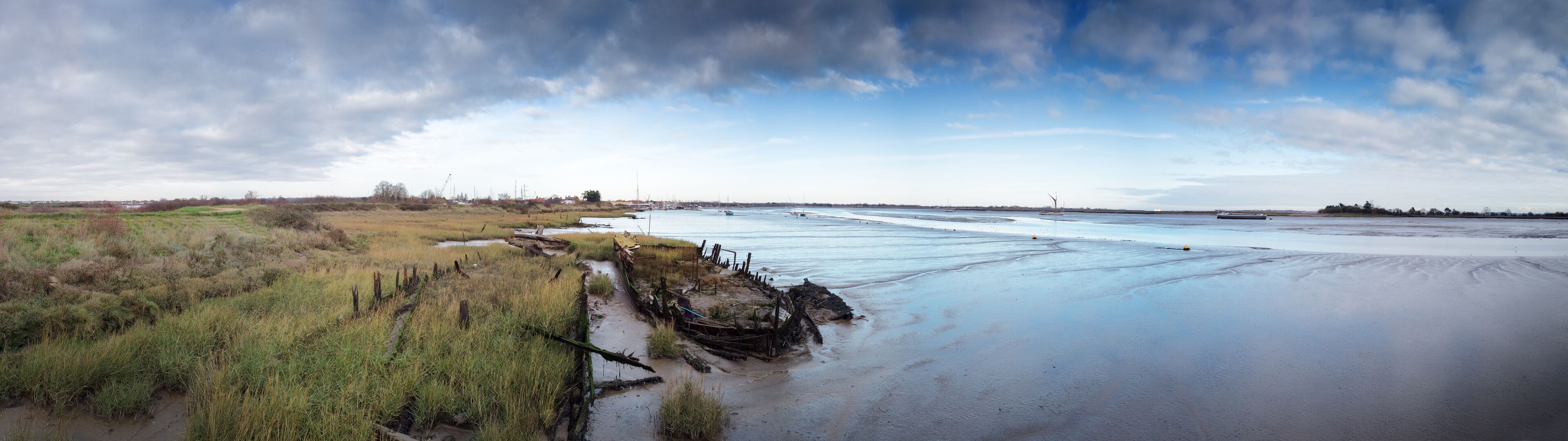 panoramic landscape image of mudflat in essex england