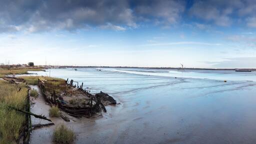 panoramic landscape image of mudflat in essex england