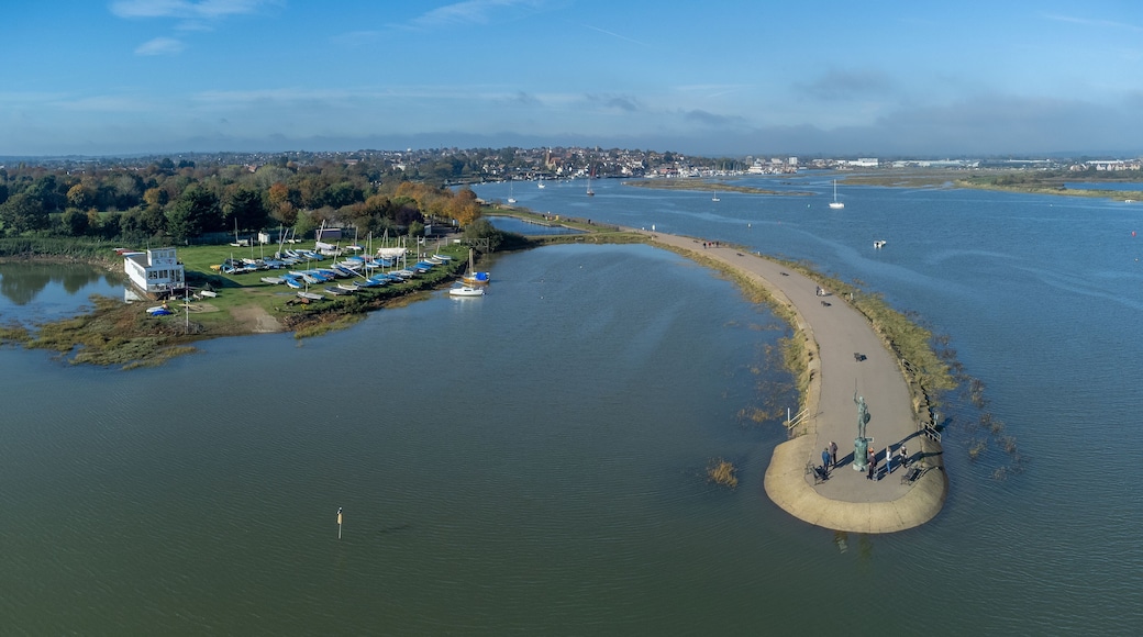 Byrhtnoth statue at the esplanade of the tourist town of Maldon in Essex, England. Boats in the marina at blackwater estuary. Drone aerial birds eye view