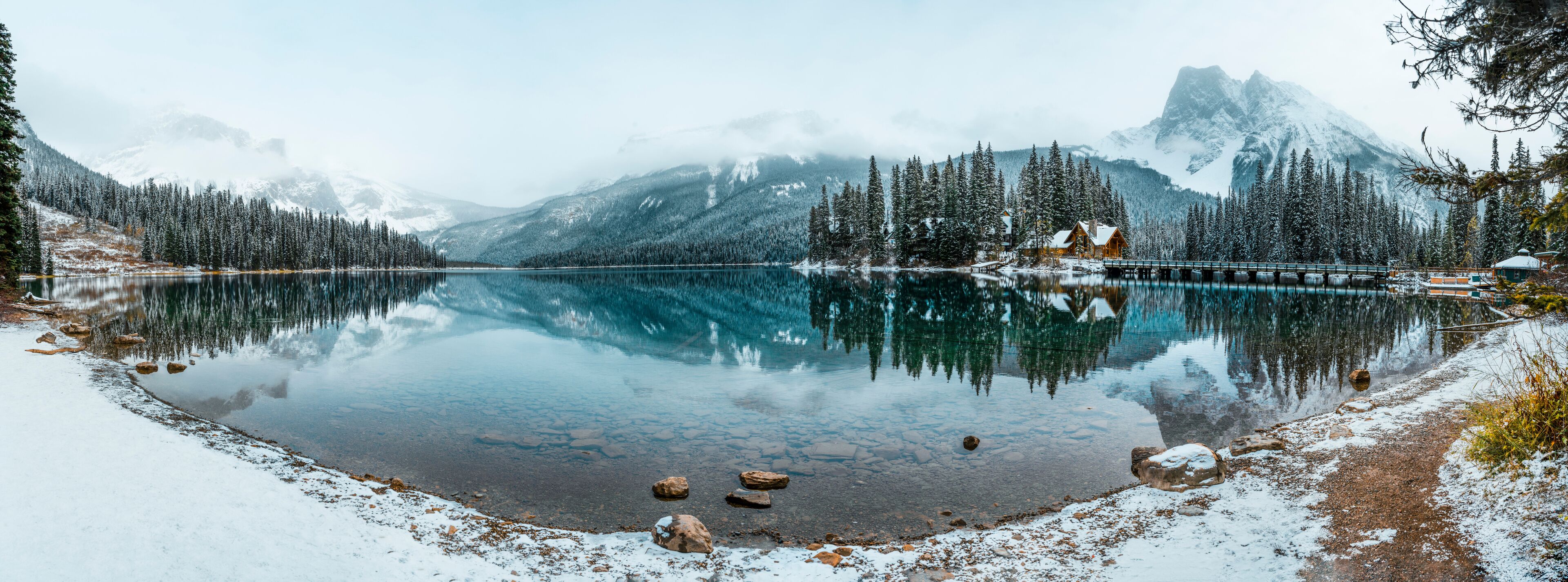 Crystal clear blue lake and snowy mountains