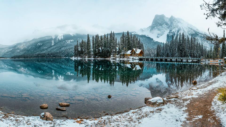 Crystal clear blue lake and snowy mountains