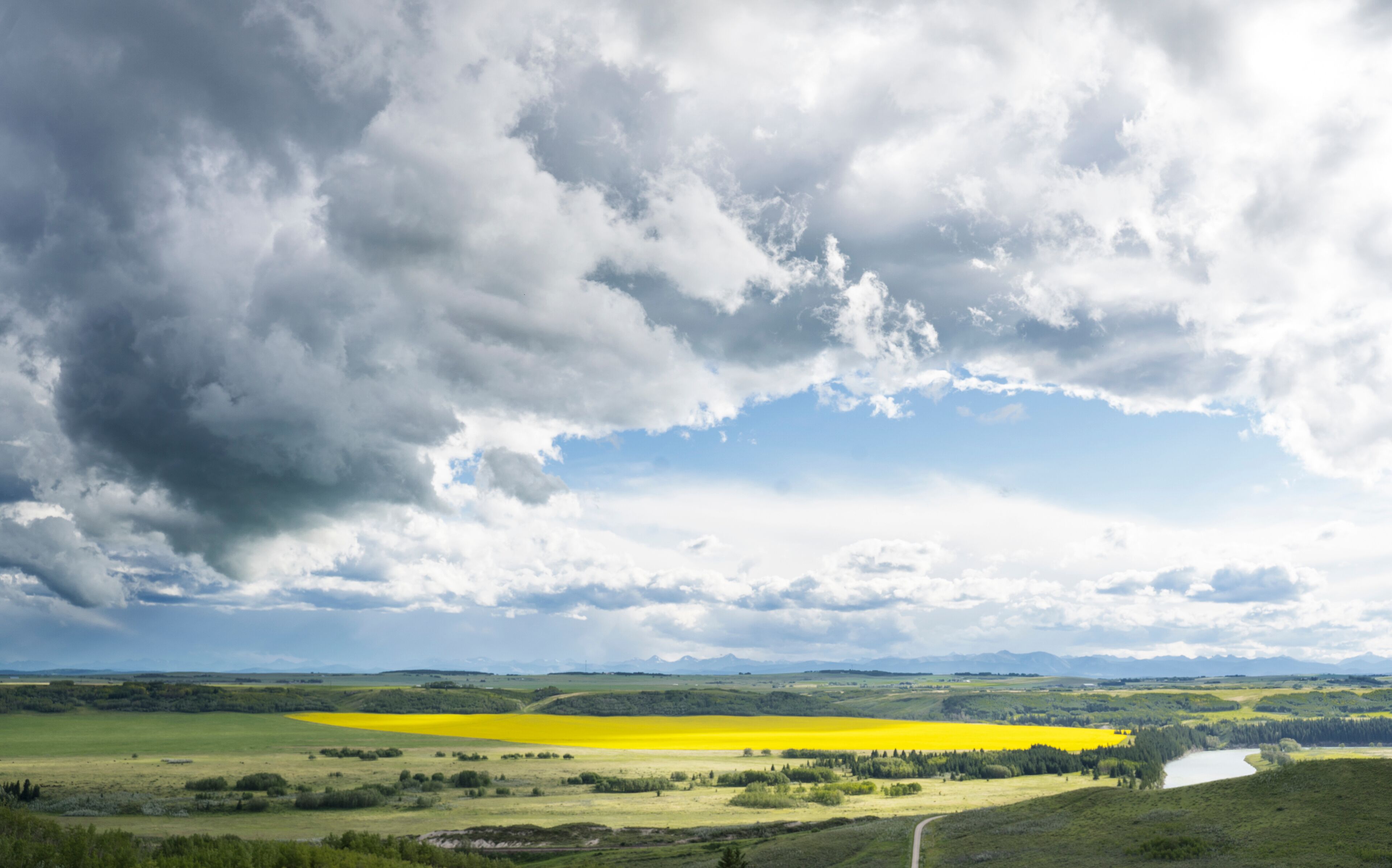 A summer storm forms over a section of the Trans Canada Trail at Glenbow Provincial Park Alberta.