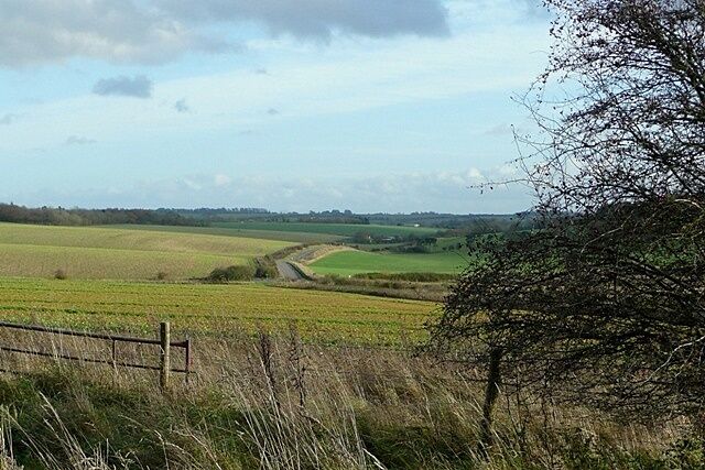 East of East Ilsley Taken from one of the many byways and bridleways that converge on East Ilsley. This one climbs to join the Ridgeway, with a view along the road towards Compton. There is extensive arable land on the lower parts of this dip face of the downs.