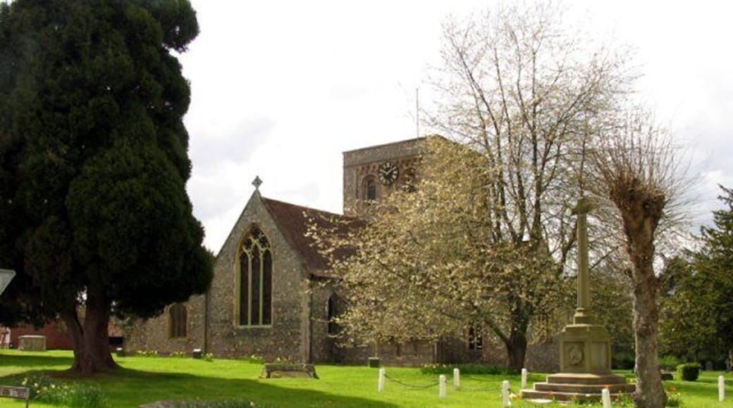Church in Kingsclere. The church is situated in the centre of the upper half of the grid square. The picture was taken from the east side of the church looking west (hence problems with the sun!). Kingsclere is an attractive village with many very old buildings.