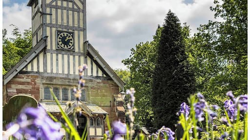 The stunning Saint Mary and All Saints Church in the Vale of Whitmore set amongst the bluebells of spring.