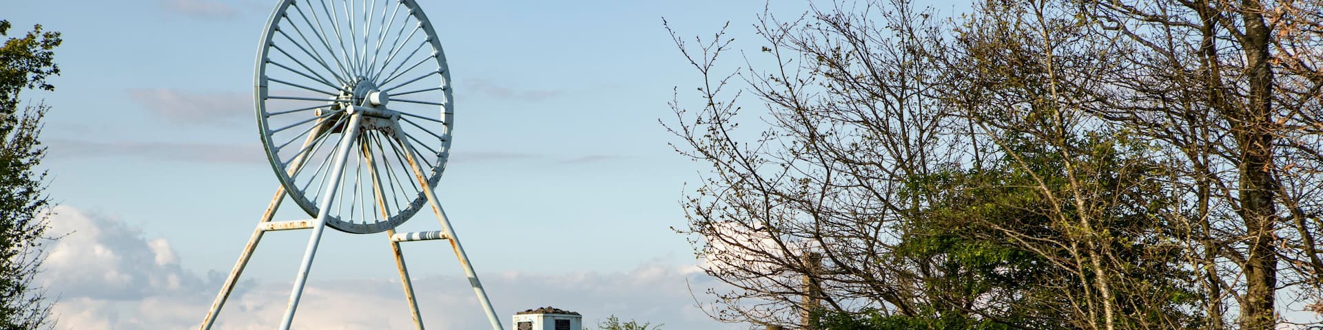 Newcastle-under-Lyme, Staffordshire, uk, 04,25.2022,Apedale pit wheel memorial and coal tub located in Apedale community park, formerly opencast mining