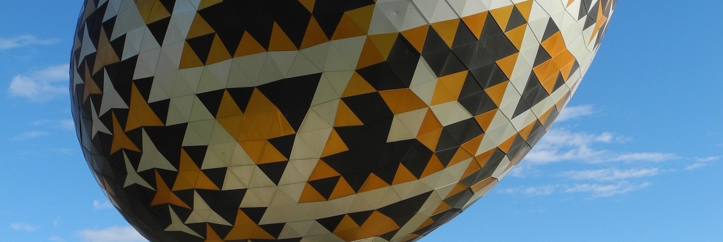 The Vegreville egg is a giant sculpture of a pysanka, a Ukrainian-style Easter egg. The work by Paul Maxum Sembaliuk is built of an intricate set of two-dimensional anodized aluminum tiles in the shape of congruent equilateral triangles and star-shaped hexagons, fashioned over an aluminum framework. The egg is 31 ft (9 m) long and three and a half stories high, weighing in at 2.5 t (5,512 lb). It is the second largest pysanka in the world. The biggest one was built in Kolomyia, Ukraine in 2000.
The sculpture was commissioned by the town of Vegreville, in the Canadian province of Alberta noted for its high Ukrainian Canadian population. In order to obtain funding for it, the town applied for a federal government grant and was eventually able to obtain some funding, but only if the sculpture was dedicated to the 1975 centennial of the Royal Canadian Mounted Police. Vegreville received a grant to construct the egg, a nod at Ukrainian culture in Canada, and specifically at early Ukrainian settlements east of Edmonton, Alberta.
#LikeALocal #TroveOnTuesday #Culture Photo Contest