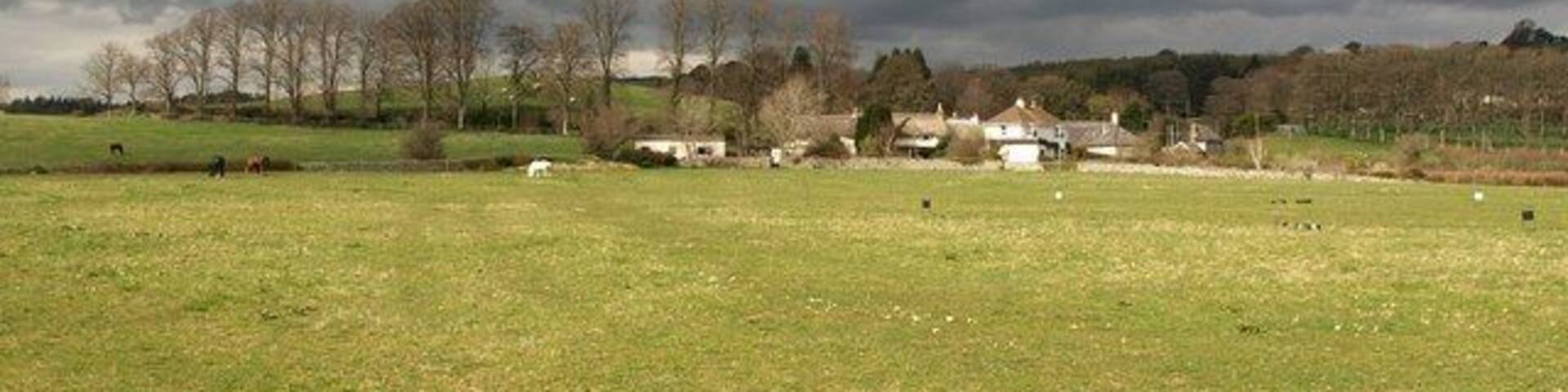 Sandypark. Bad weather brews over the hamlet in the Teign valley, seen from the fieldside path mentioned in 1243007.