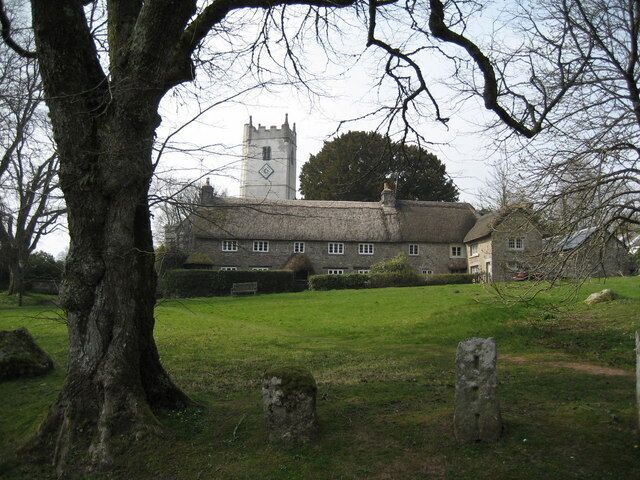 Church Tower and Church House at Manaton The green and a wonderful thatched cottage at Manaton. St Winifred's Church tower is in the background.