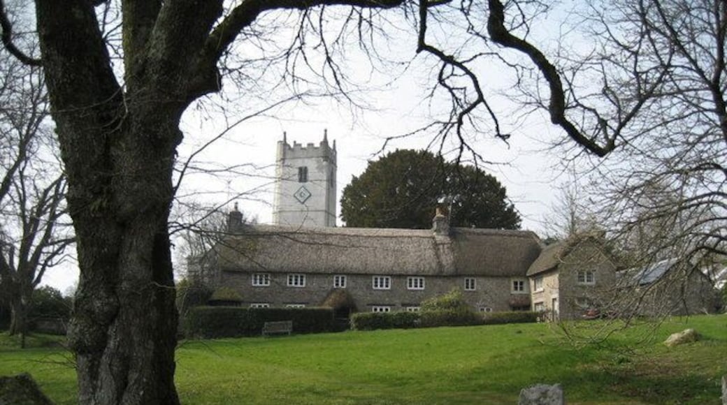 Church Tower and Church House at Manaton The green and a wonderful thatched cottage at Manaton. St Winifred's Church tower is in the background.