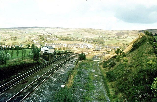 Diggle Junction signalbox 1981 Diggle was where the passenger and goods line from Standedge Tunnel exchanged tracks and then separated to opposite sides of the valley for the run to Stalybridge. The train in the distance is about to enter the tunnel, en route to Leeds.