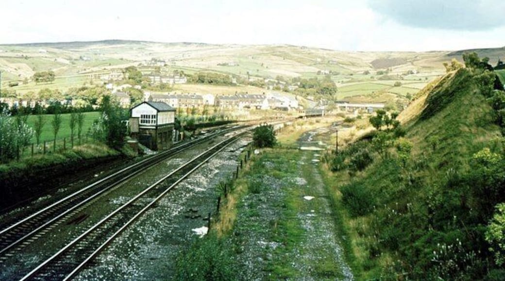 Diggle Junction signalbox 1981 Diggle was where the passenger and goods line from Standedge Tunnel exchanged tracks and then separated to opposite sides of the valley for the run to Stalybridge. The train in the distance is about to enter the tunnel, en route to Leeds.