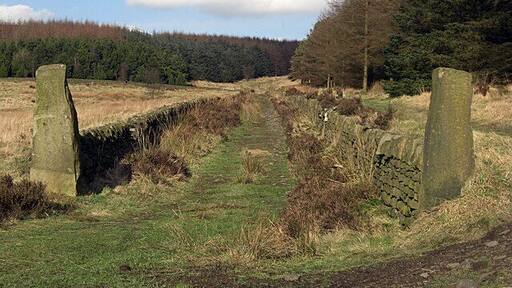 Crompton Moor This walled track is on the lower slopes of the moor above Brushes Clough quarry. There are many tracks on this large area of open space on the edge of Shaw's urban area. It is a very popular amenity for off road cyclists, dog walkers and other lovers of the countryside.