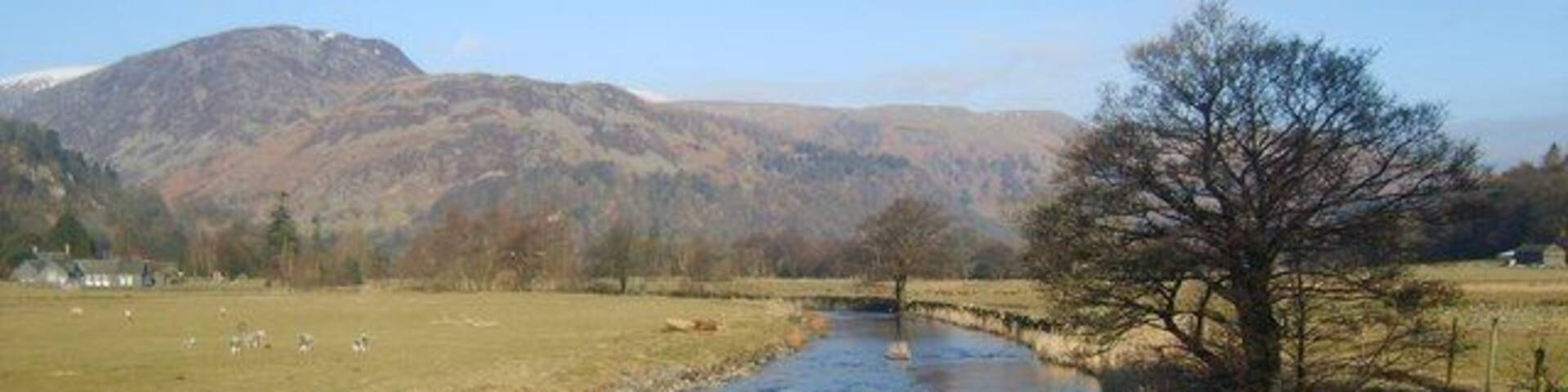 Goldrill Beck From the bridge to Side Farm and Rooking. The name Goldrill first documented in 1780. Means 'The stream where marigolds grow' relating to the kingcup or marsh marigold. None in evidence today in this cold early spring.Sheffield Pike and Glenridding Dodd in shot.