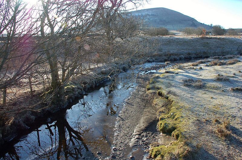 Trout Beck on a frosty morning The stream that gives the hamlet of Troutbeck its name, from the bridge on the minor road to Wallthwaite. Great Mell Fell (537 m) is the hill in view.