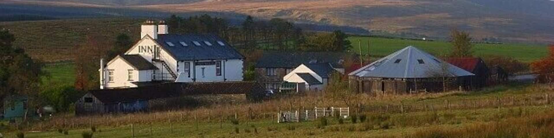 Troutbeck Inn The hamlet of Troutbeck surrounds a sheep market and former railway station. Clough Head, the northern end of the Helvellyn range, is in the background.