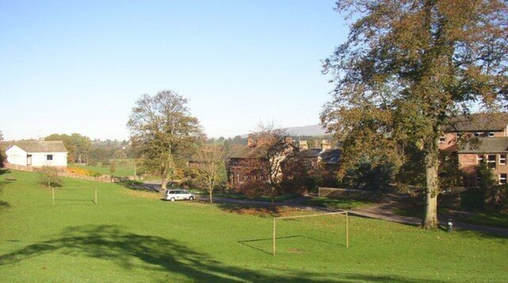 Football ground on the village green, Temple Sowerby Sometimes the ball must go careering off down the road!