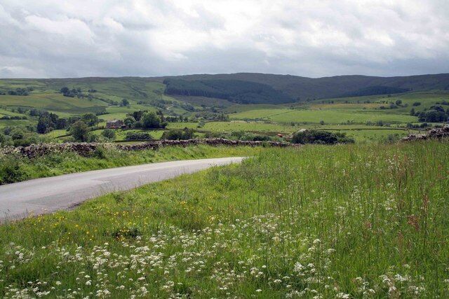 the road to Greenholme After a shower its very clear today looking down the valley towards Greenholme.