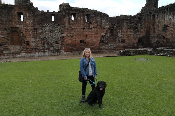 Red ruins of a Castle in the market town of Penrith. There's also a park with bandstand & cafe.