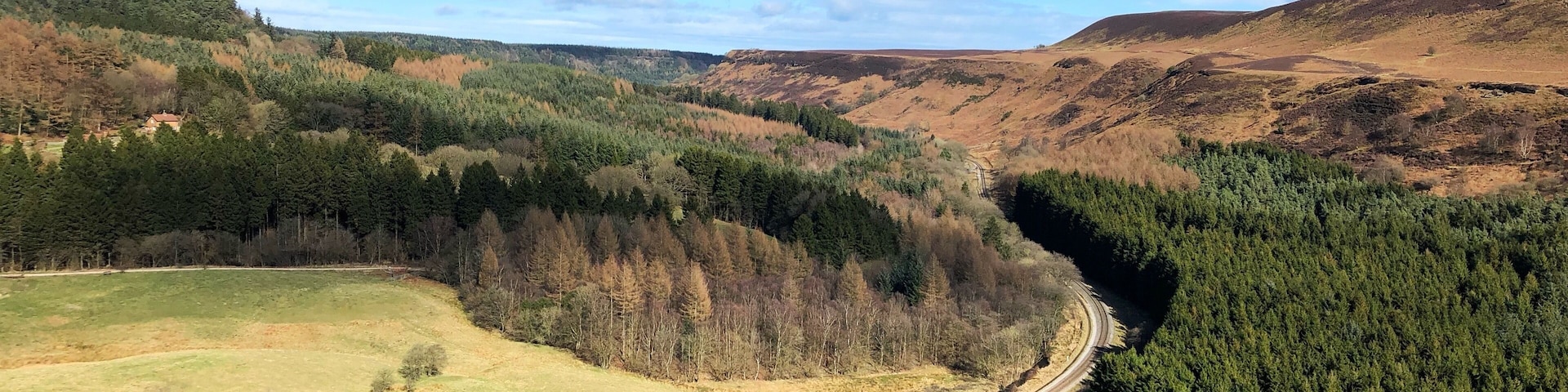 Newton Dale is part of the route which the North Yorkshire Moors Railway runs through. There is a good circular, and not to difficult hike, from the train station around the valley which gives some spectacular views of the countryside also. Pickering is the main town to catch the train and there are various stops on route too.