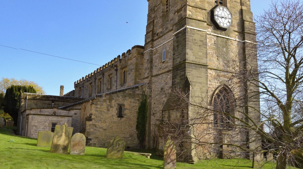 "The early Norman Church, which was built c. 1140, would have been of simple cruciform layout, with a central tower surrounded by a nave, a chancel and two transepts. Soon, aisles were added to this original structure: the north aisle in about 1150 and the south aisle towards the end of the twelfth century. The present west tower was built in the early part of the thirteenth century, and sometime in the fourteenth century the chancel was widened to cope with the liturgies of the period. A porch was also added, and then, in the fifteenth century, two chantry chapels, either side of the high altar. On the abolition of the chantries, the Roucliffe Chapel, on the south side of the sanctuary, was for some time a school, before, in 1920, undergoing renovations to restore it to liturgical use." (From Web site)