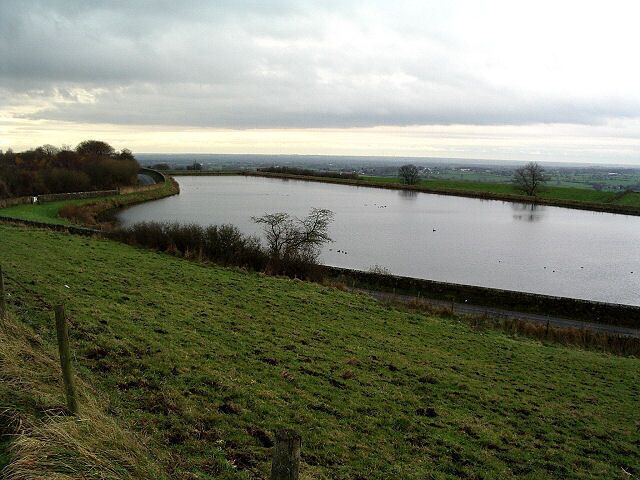 Longridge Reservoir. Looking West over the small reservoir on the edge of Longridge. On a clear day Blackpool and the coast would be easily seen on the horizon.