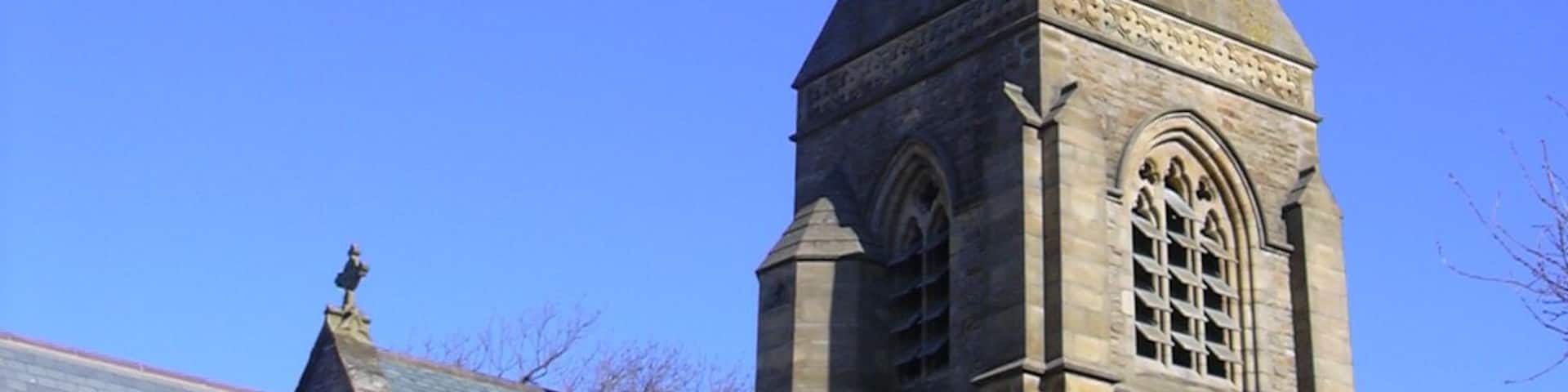 Spire and upper stages of the south tower of St Nicholas' parish church, Wrea Green, Lancashire, seen from the southwest