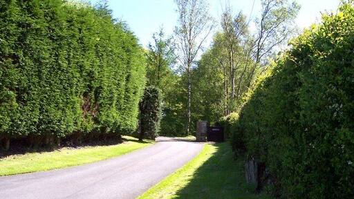 Entrance for path to Higher Lane from Tithe Barn Lane Cattle grid in road with stile to the left of gateway leads to the path