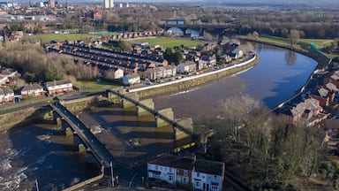 Aerial panorama of River Ribble bridges and Preston city skyline.