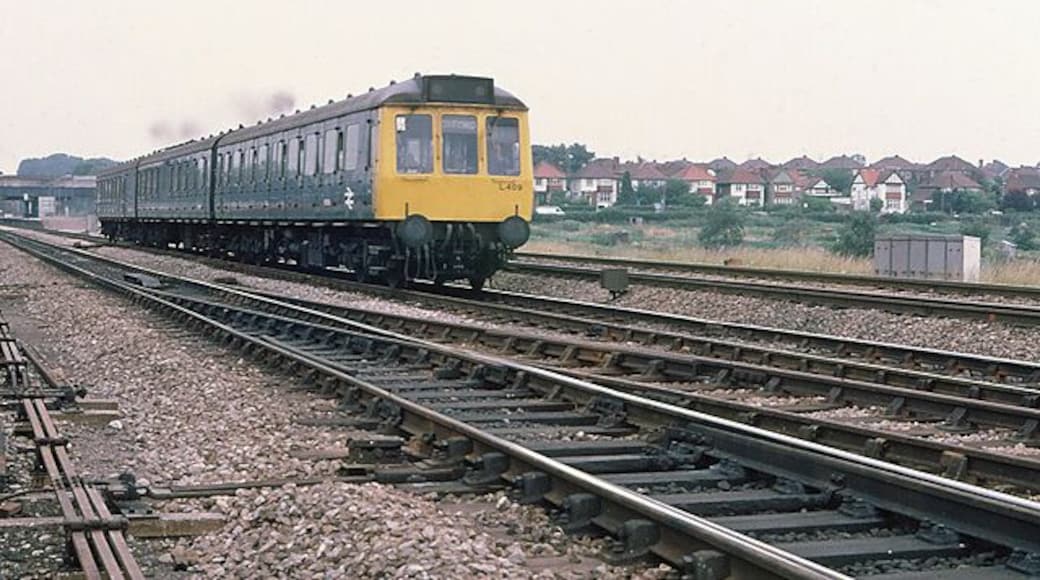 Departing Twyford A Paddington to Oxford stopping service departs Twyford station, visible in the background on the left. On the right, the allotments beside the railway line are visible and beyond them the houses on Hurst Road. The slow lines here were still constructed of wooden sleepers and bullhead rails in 1978, though they have sebsequently been relaid and the trailing crossover in the foreground removed. The rail in the extreme foreground is of the more modern flat bottomed type and the difference in depth of the two types of rail is evident just left of centre where they are joined by a fishplate.