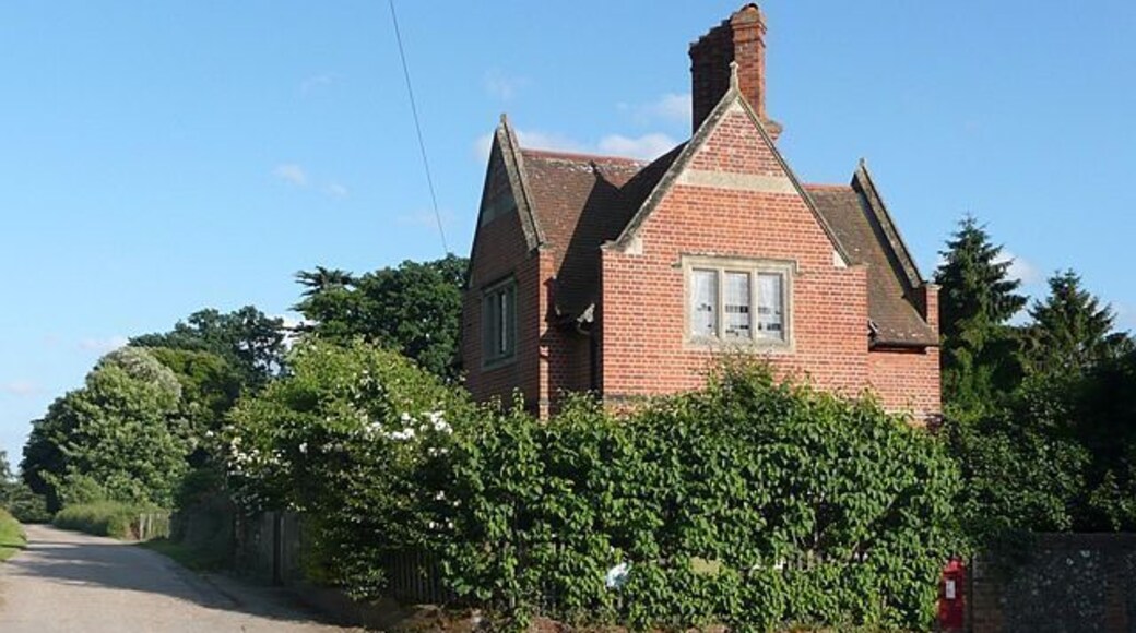 The Lodge, Mapledurham, Oxfordshire. Its chimneys and gables emulate those of the house. The track to the left is the bridleway via Park Farm to The Warren in Reading.