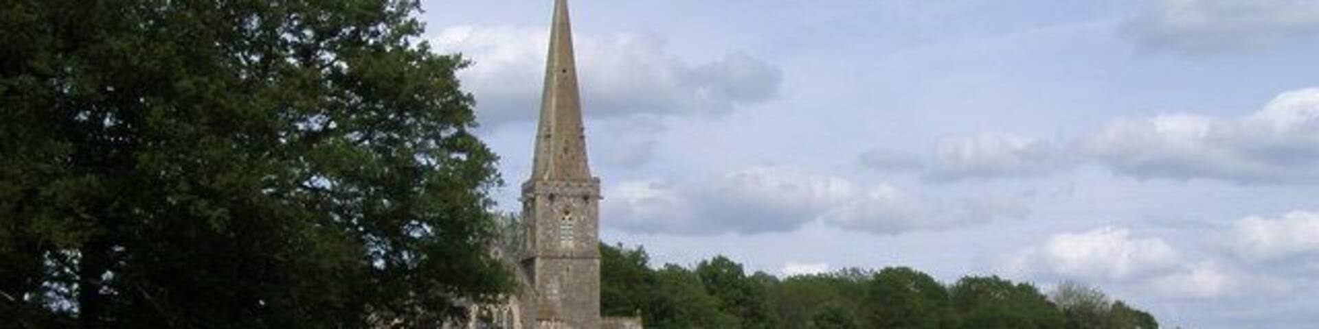 View northeast across a field at Midgham, Berkshire to St Matthew's parish church