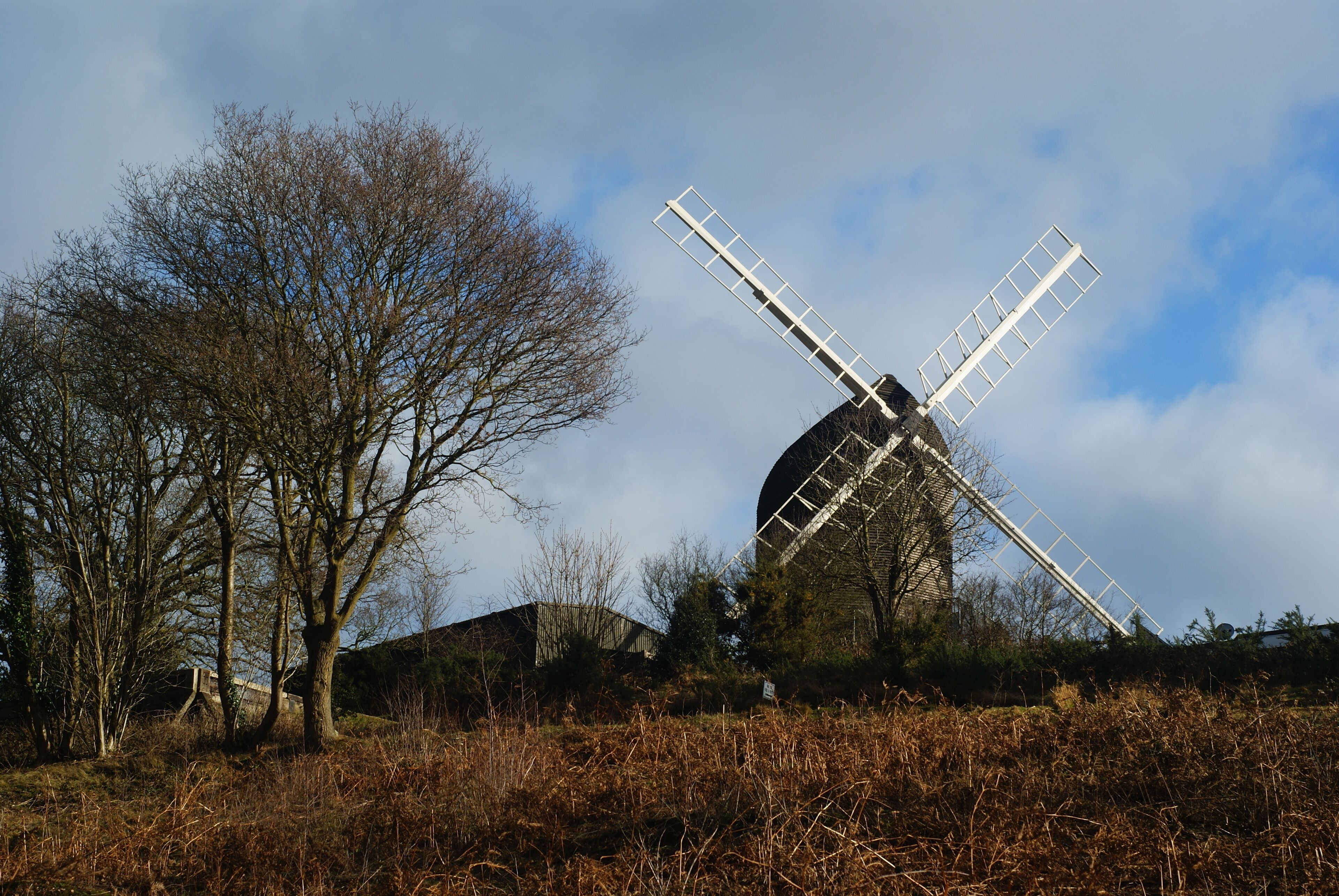 Reigate Heath Windmill, Surrey Reigate Heath Windmill is a grade II listed post mill at Reigate Heath, Surrey, England which has been restored and is used as a chapel. It is thought to be the only windmill in the world which is a consecrated church. http://en.wikipedia.org/wiki/Reigate_Heath_Windmill Photographed from a path on the golf course. The view was made easier by the recent felling of two trees in the foreground.