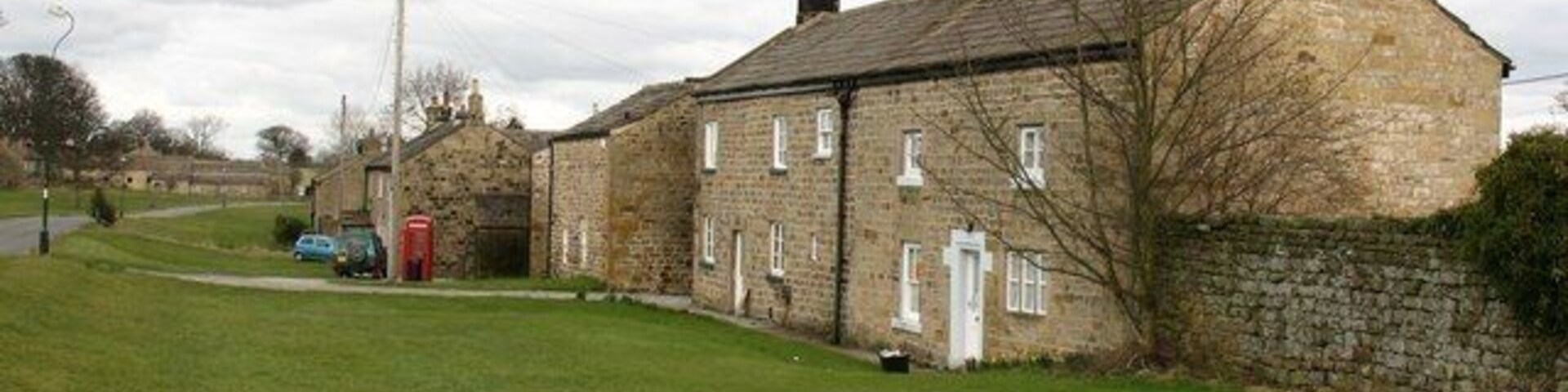 Cottages by the green Fearby has a large and irregularly shaped green with a scattering of stone built cottages around its margins.