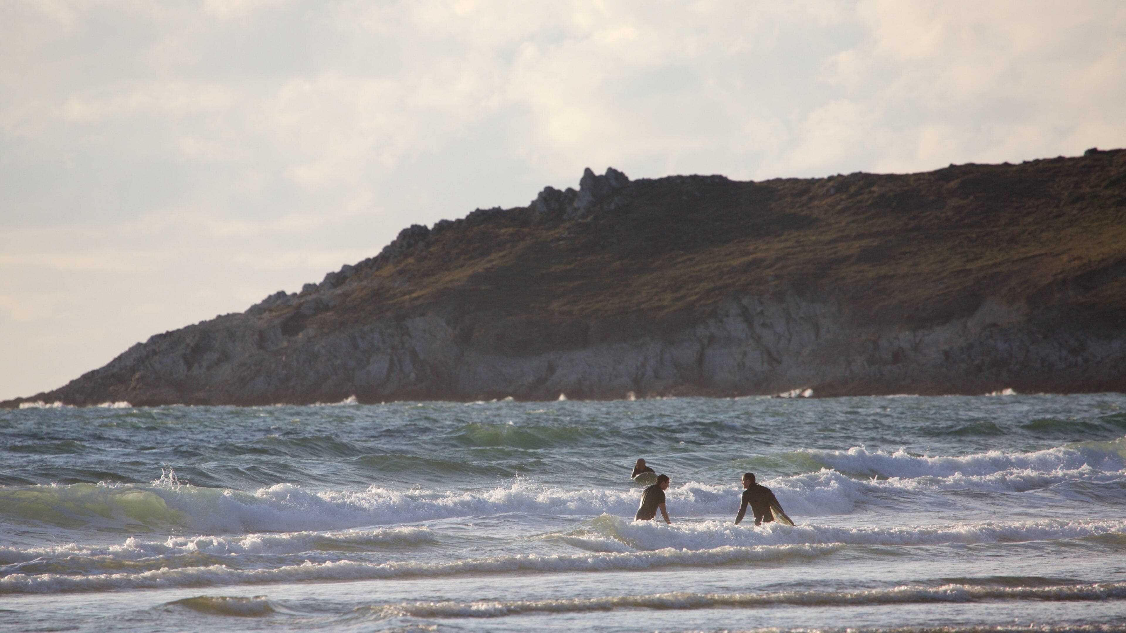 Woolacombe featuring rocky coastline, swimming and surf