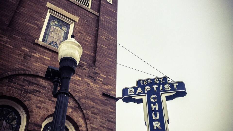 A street sign for 16th St Baptist Church.