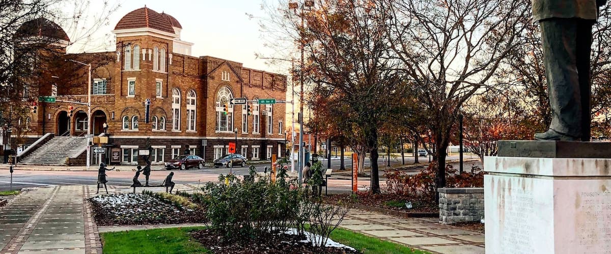 A statue of Martin Luther King Jr. looks towards the 16th Street Baptist Church in Birmingham, Alabama.  The 1963 bombing of the church by the KKK murdered 6 children in total and sparked outrage across the world. This  marked a turning point in the Civil Rights Movement. #civilrights #historymatters